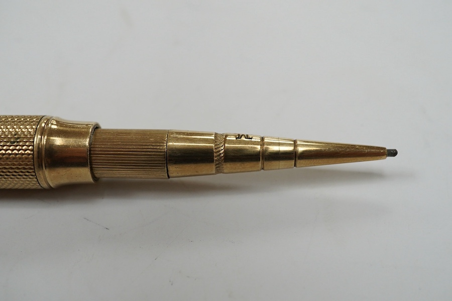 A George V 9ct gold cased propelling pencil by Sampson Mordan & Co, London, 1928. Condition - fair to good